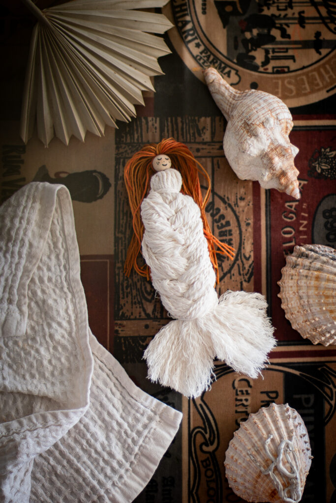 Mermaid doll and shells