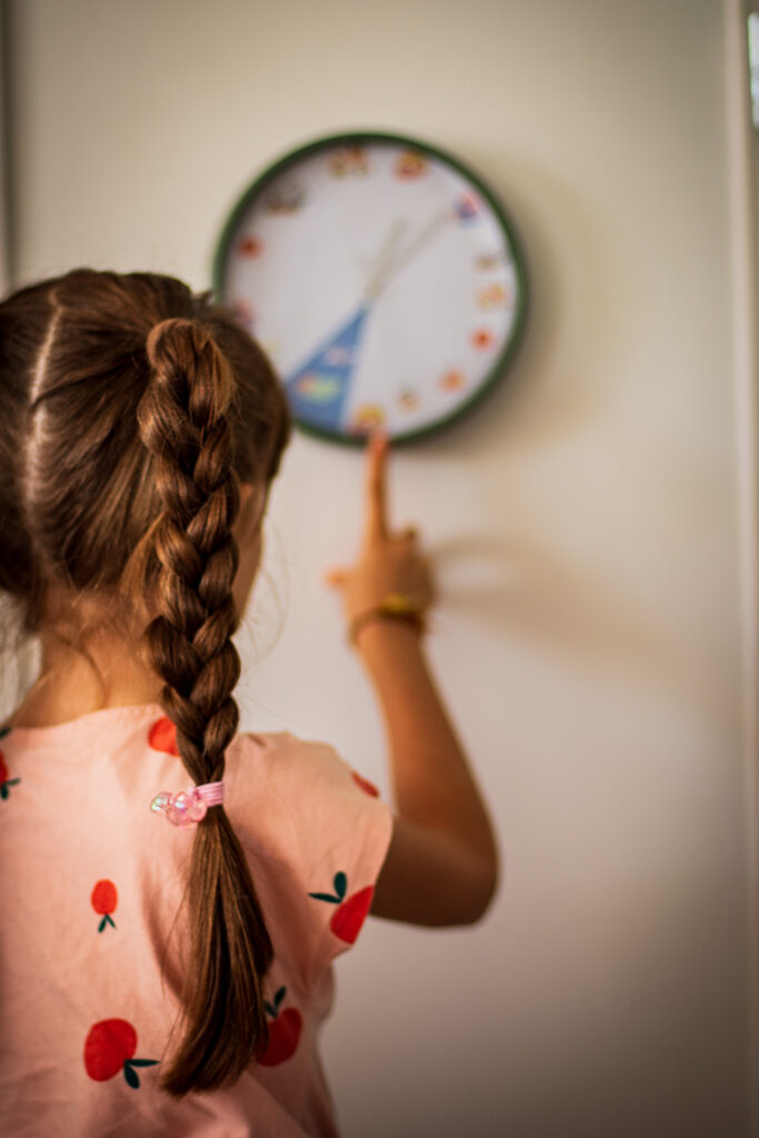 Girl using a routine clock